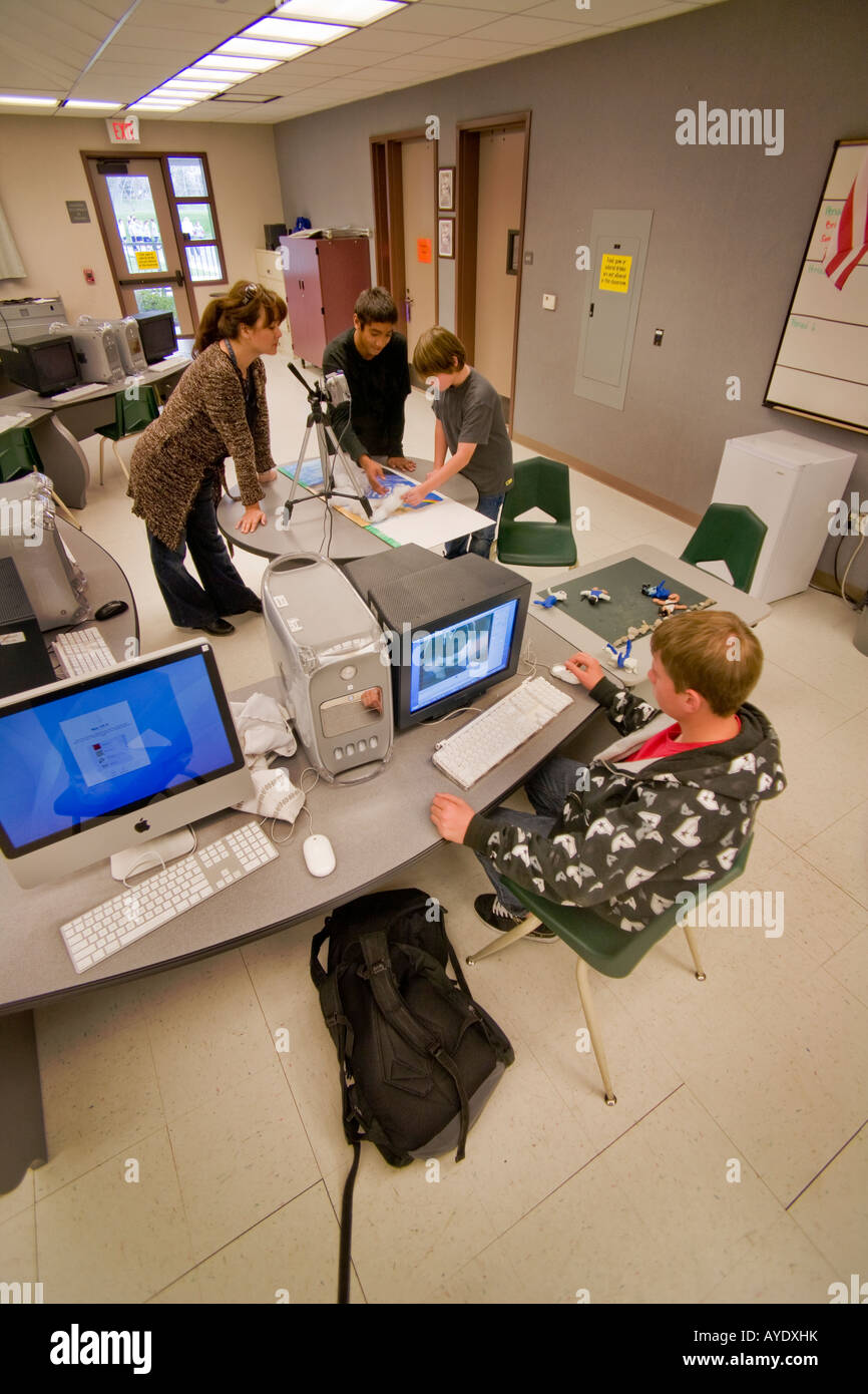 Teacher and students in middle school computer animation class Stock Photo  - Alamy