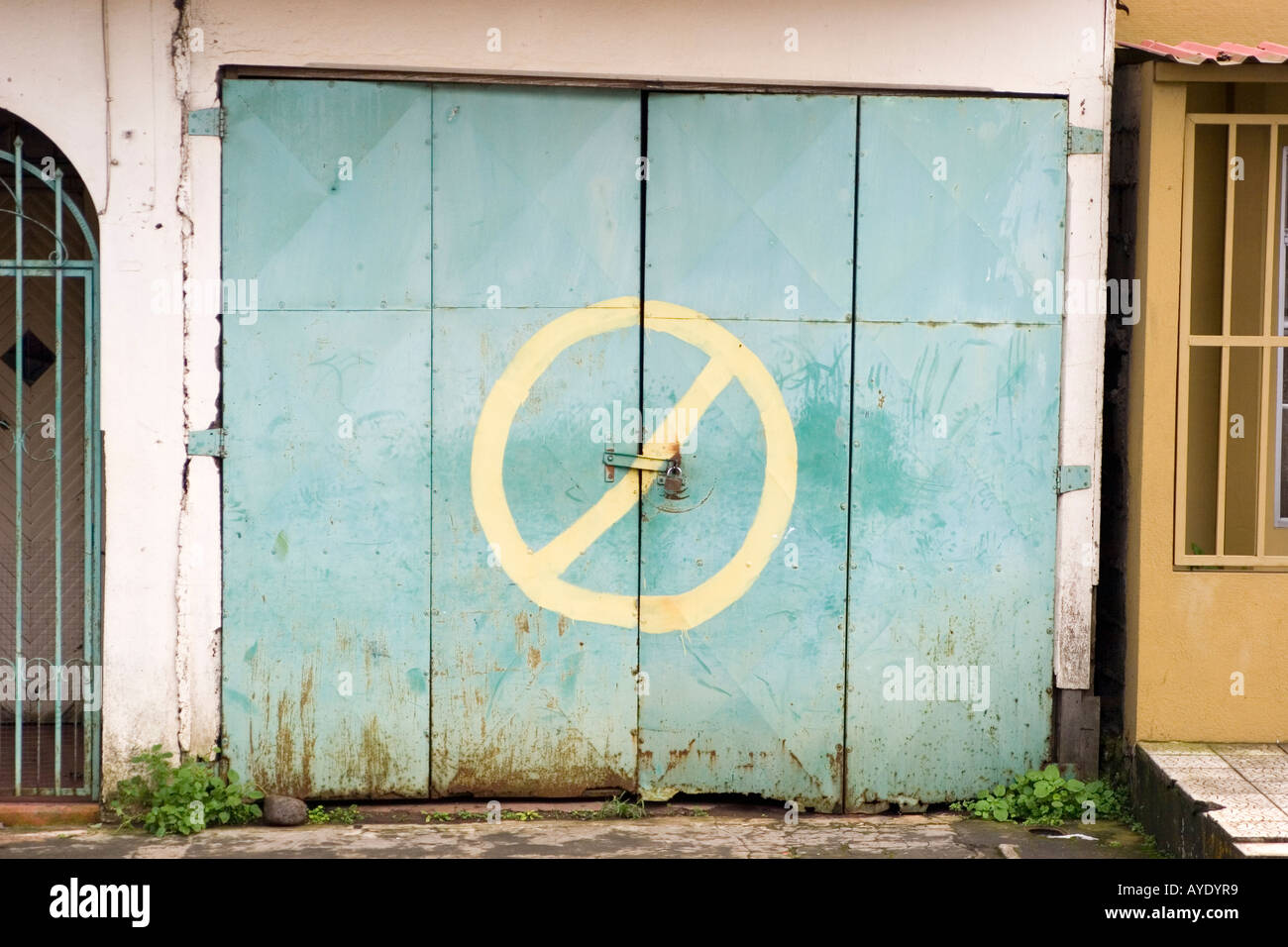 No Parking. A private garage in San Ramon Costa Rica with a sign meaning No Parking Stock Photo