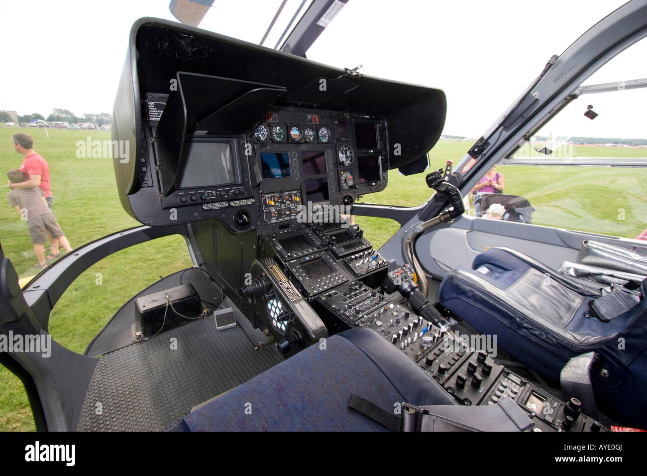 Cockpit controls and flight deck instruments in front of police helicopter Stock Photo