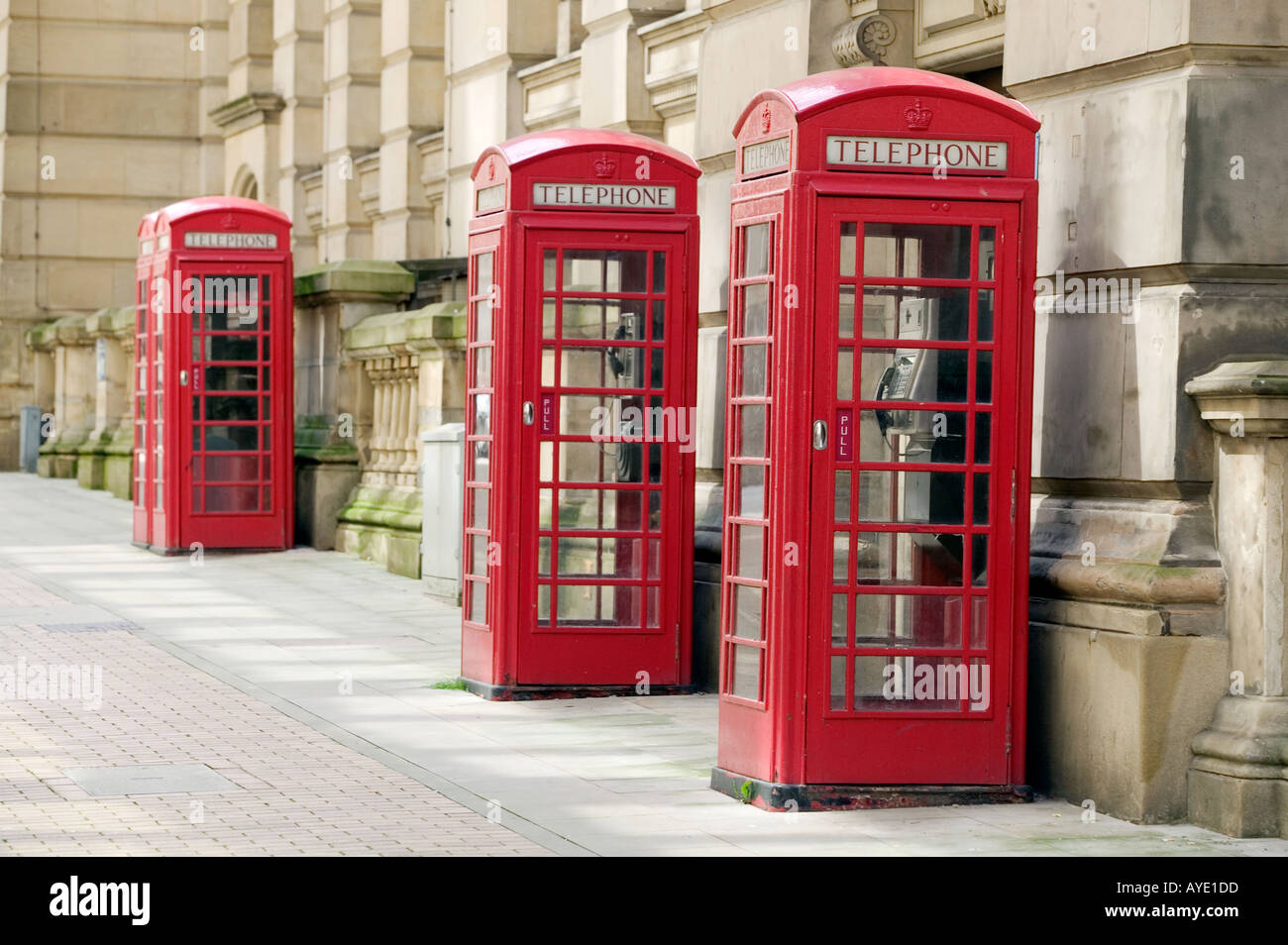Three K6 standard red telephone boxes adjoining the Birmingham City Council building in Birmingham city centre UK Stock Photo
