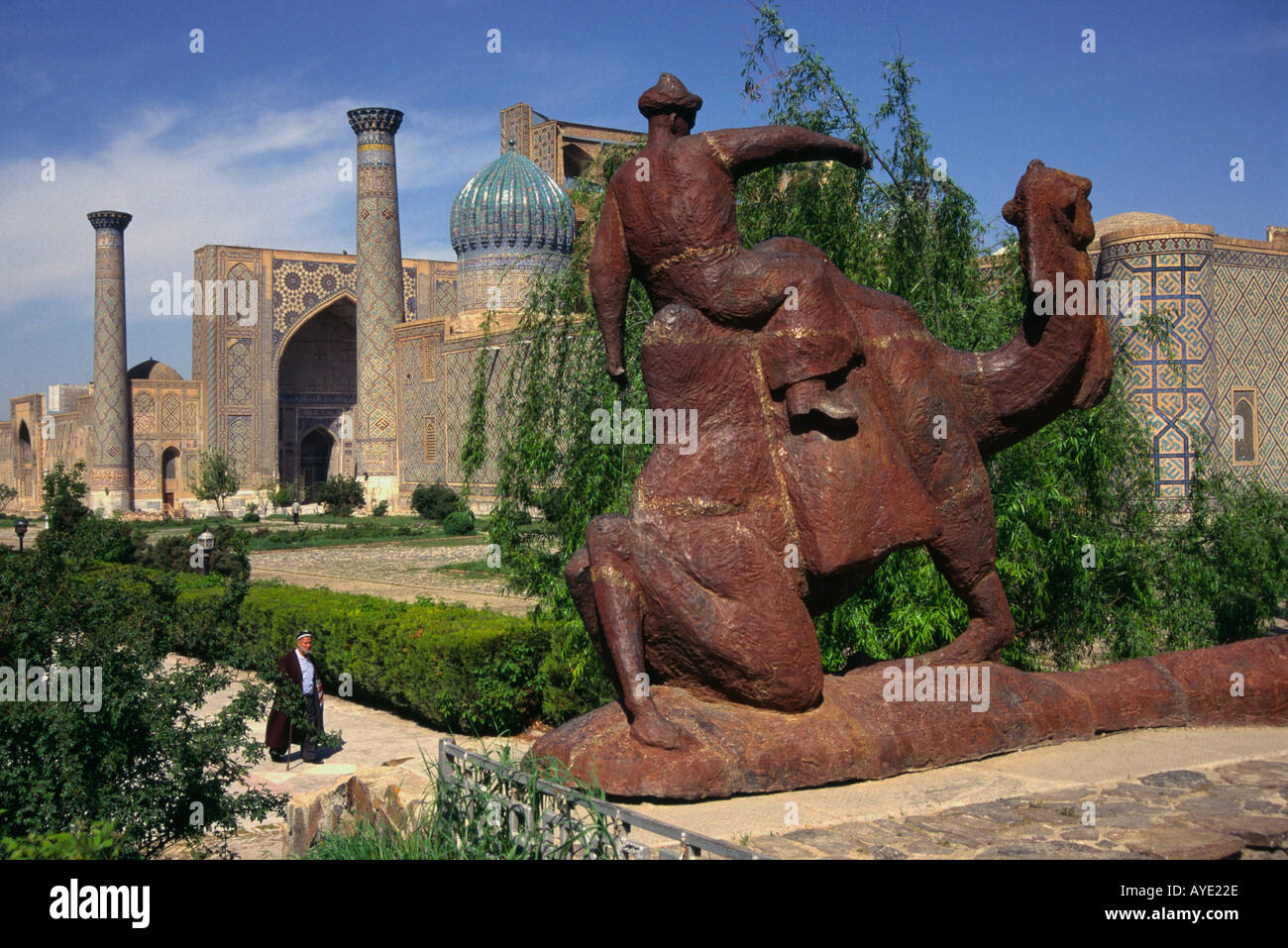 Central Asia Uzbekistan Samarkand The Registan Statue of a man on camel  with madrasses in bkgd Stock Photo - Alamy