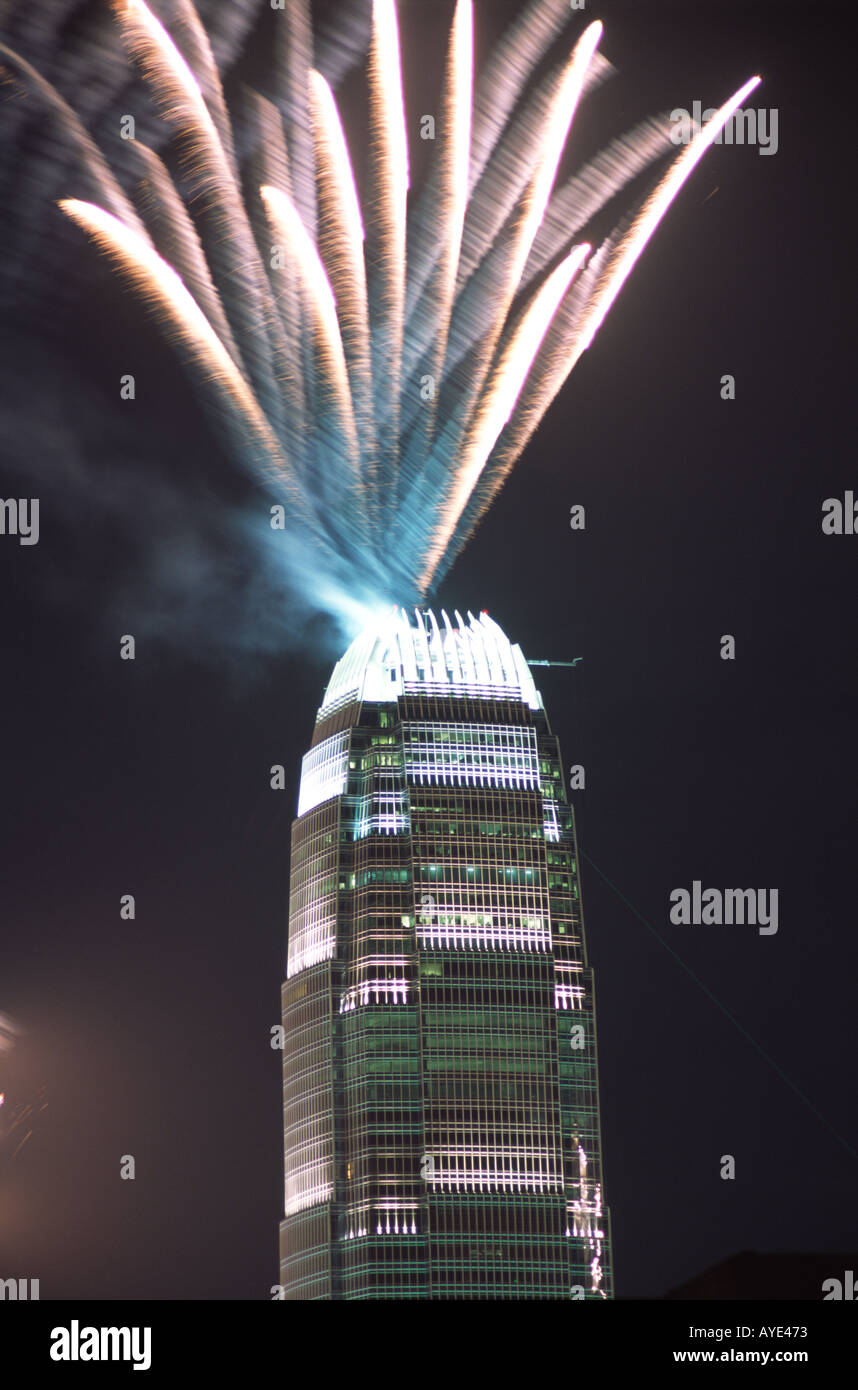 Fireworks explode from the roof of the International Finance Center in Hong Kong during the Lunar New Year Stock Photo