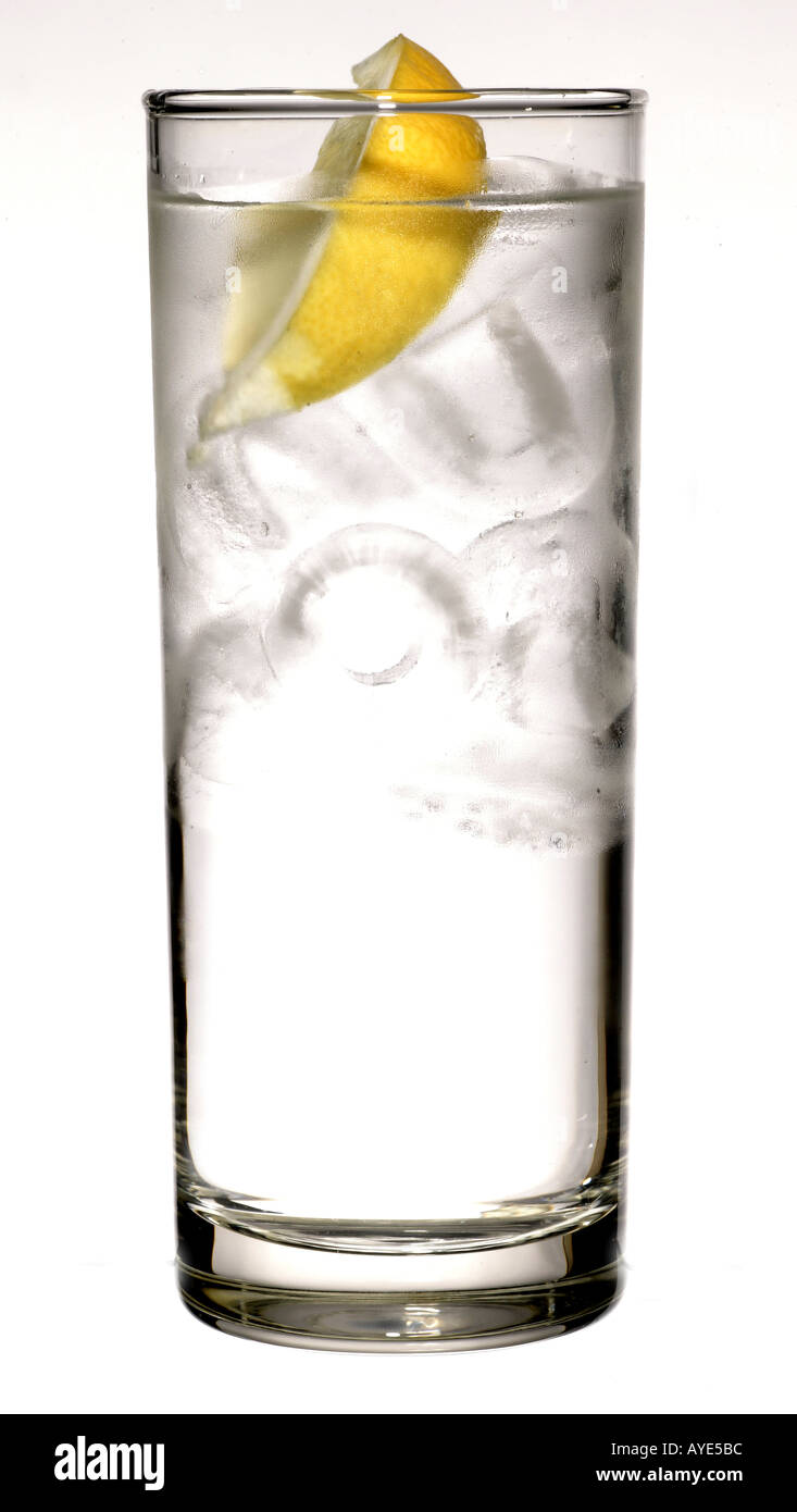 Glass of still mineral water with ice and a lemon Stock Photo