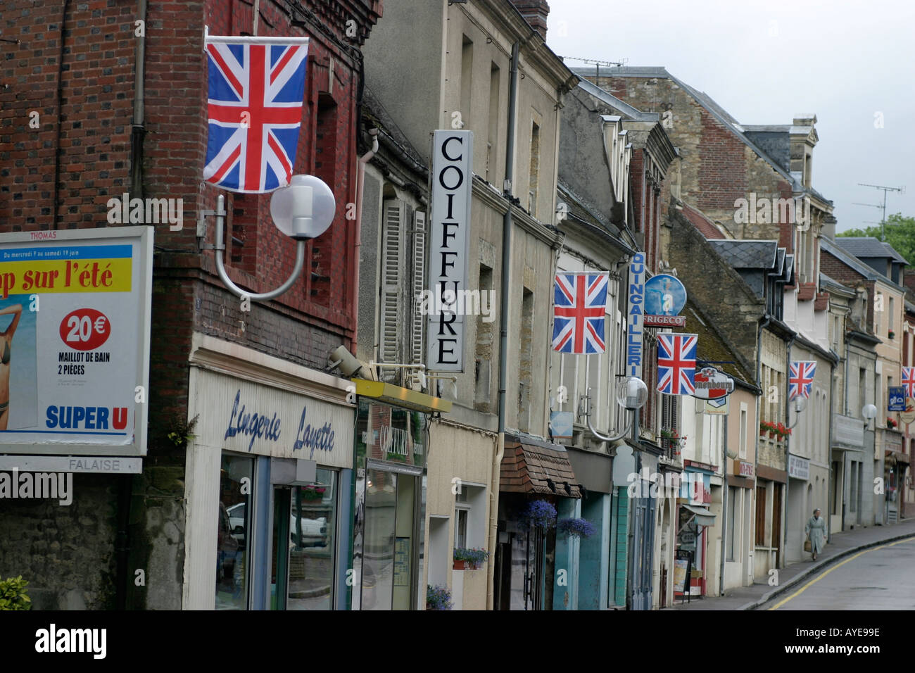 Union Jacks flying in a street in St Pierre sur Dives during the D Day Diamond Jubilee Commemorations 2004 Normandy France Stock Photo