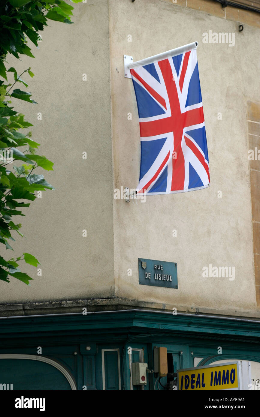 A Union Jack flying in a street in St Pierre sur Dives during the D Day Diamond Jubilee Commemorations 2004 Normandy France Stock Photo