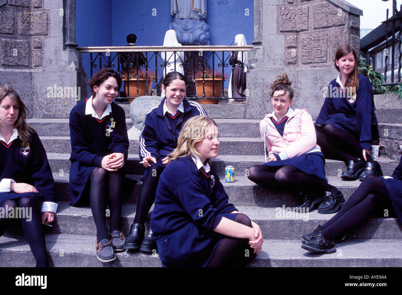 A group of Catholic School girls lounging during recess Dingle Ireland Stock Photo