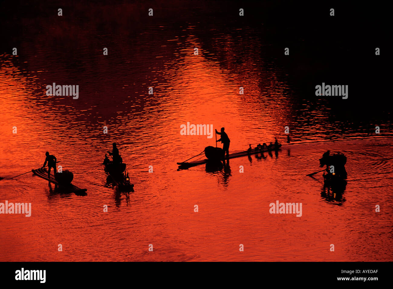 Fishing rafts on the Li River at sunset Guangxi Province China Stock Photo