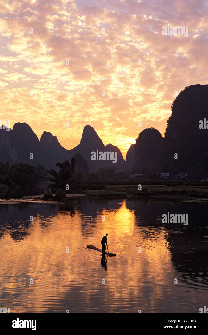 Fishing on the Li River at sunset Yangshuo Guangxi Province China Stock Photo