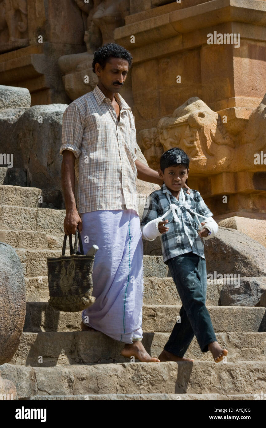Boy with Both Arms in Casts in Brihadishwara Hindu Temple in Thanjavur South India Stock Photo