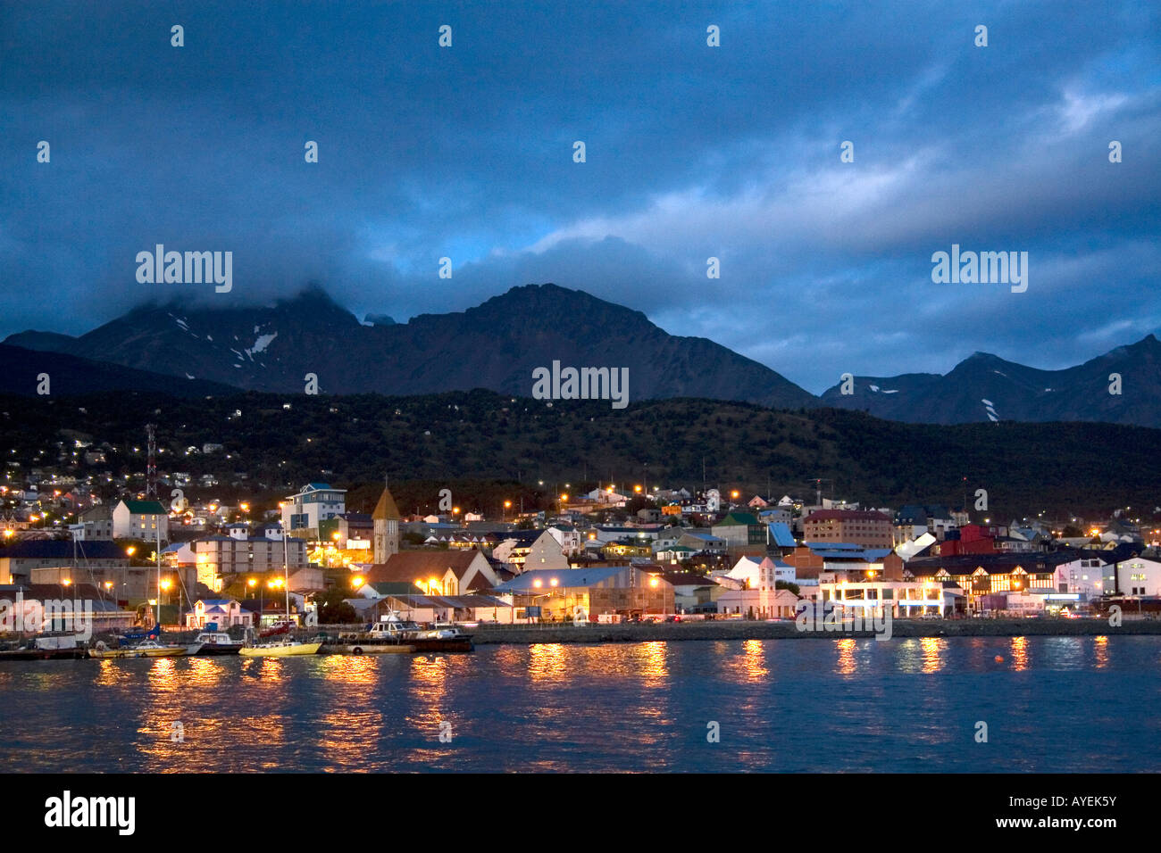The harbor and city of Ushuaia at dusk on the island of Tierra del Fuego Argentina Stock Photo