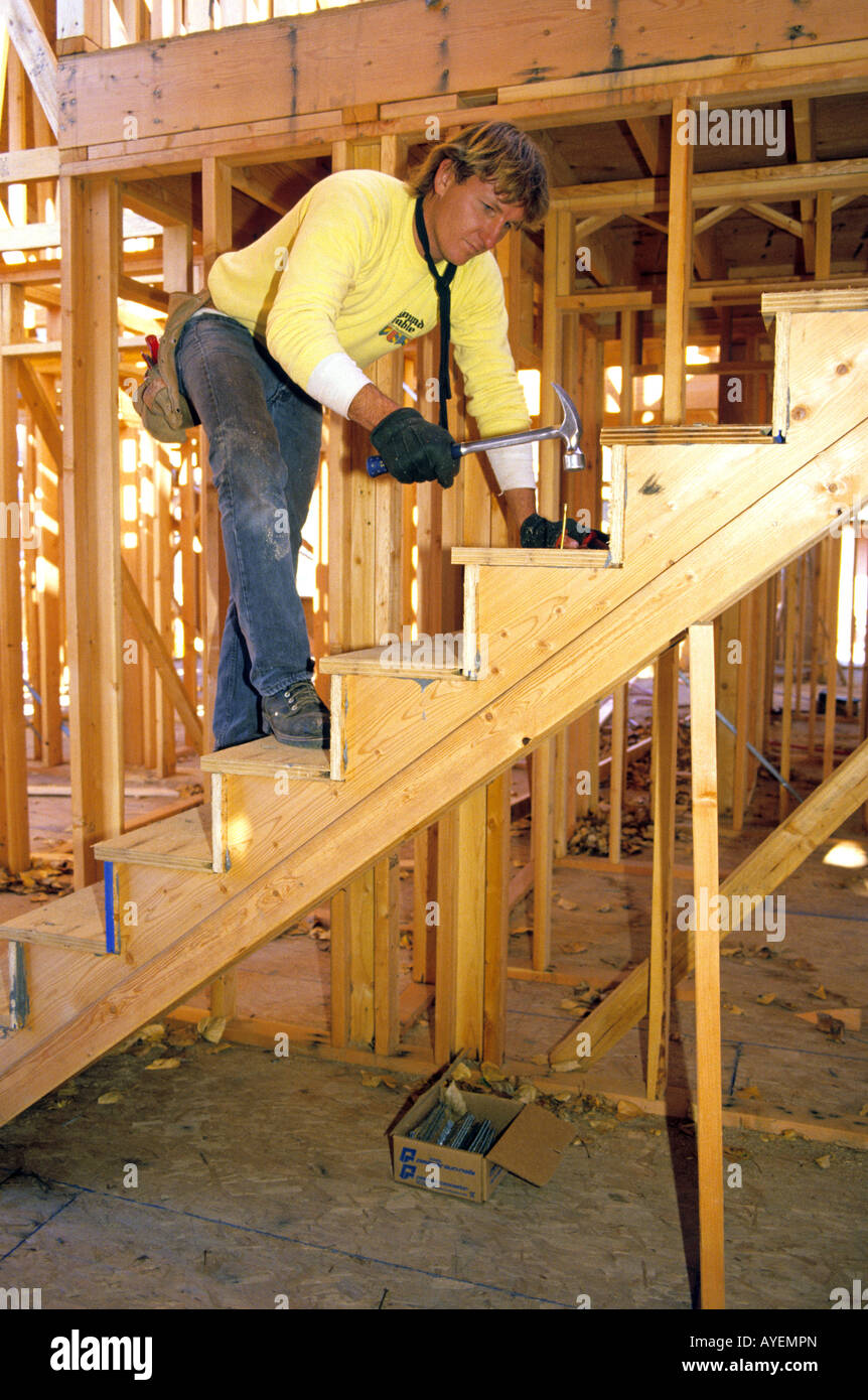 Carpenter building a stairs Stock Photo Alamy
