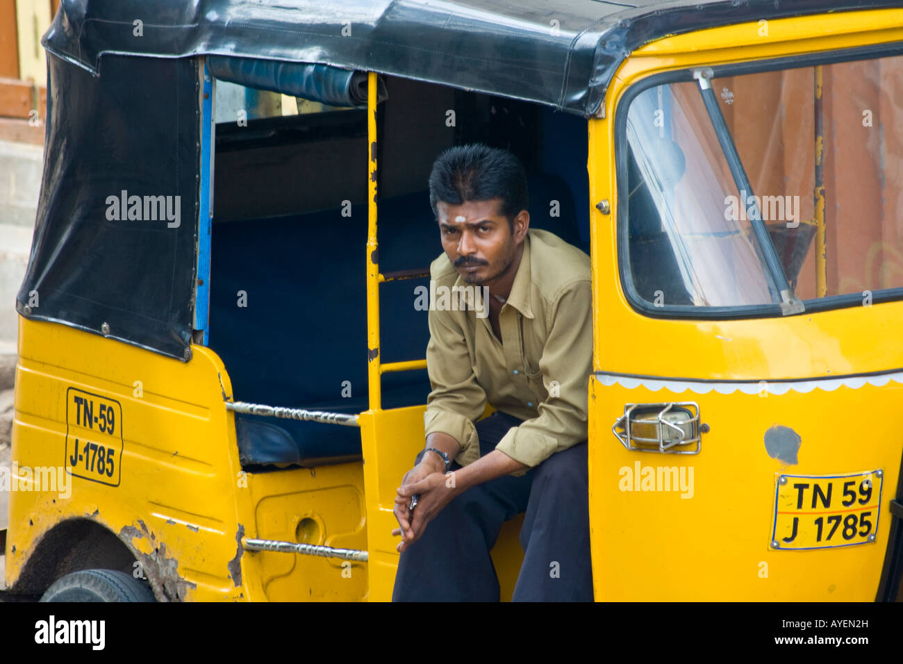 Young Indian Man in an Autorickshaw in Madurai South India Stock Photo