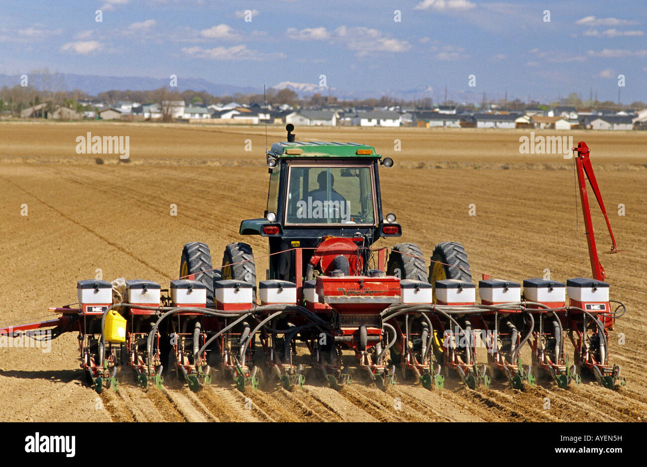 Tractor pulling a seed corn planter Stock Photo