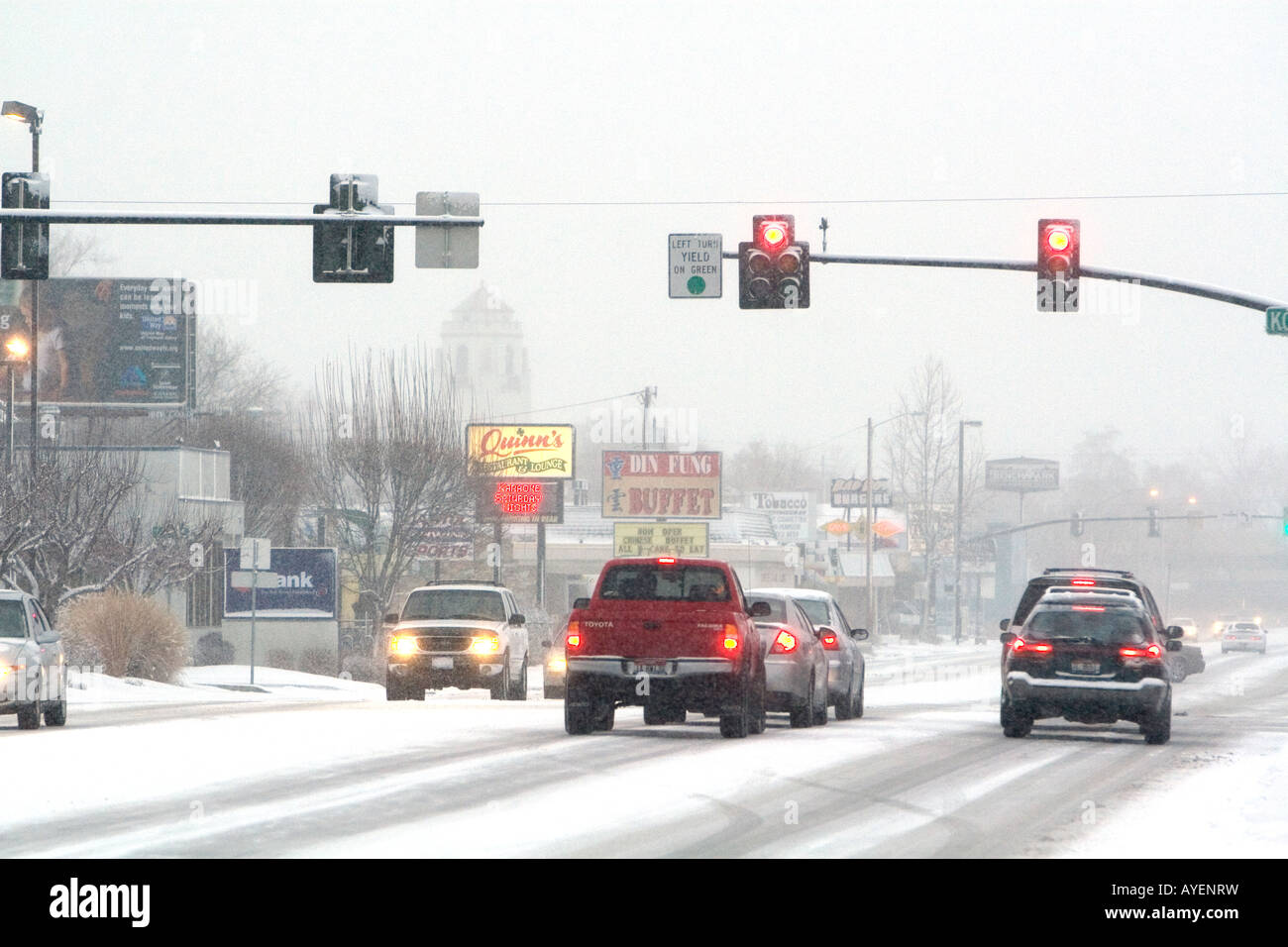 Traffic at a stop light on a snowy day in Boise Idaho Stock Photo