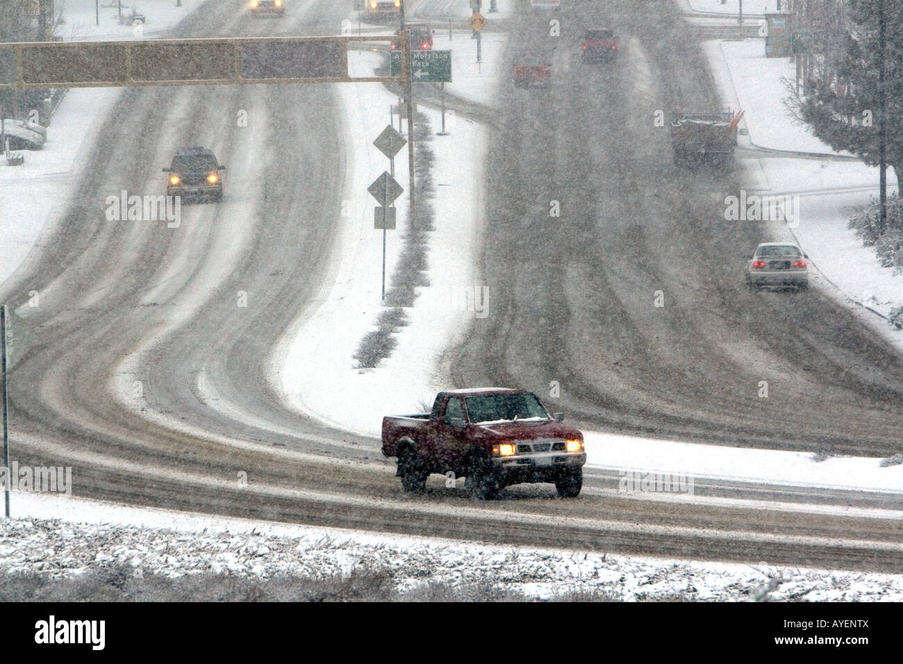 Automobiles driving on a snowy day in Boise Idaho Stock Photo