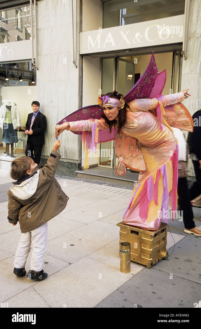 Street performer and child Via Cappello Verona Stock Photo
