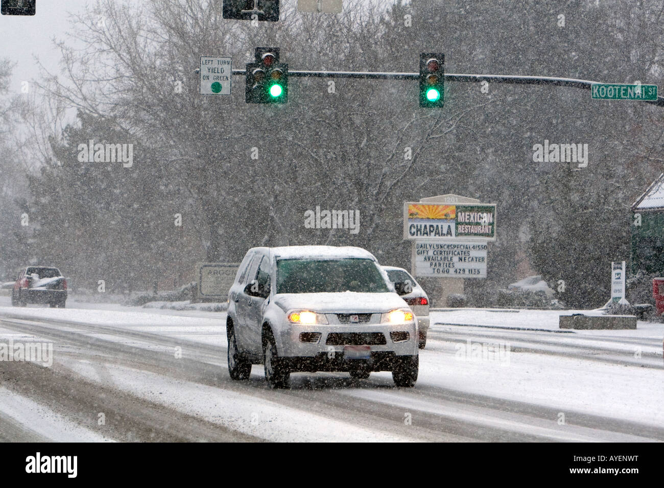 Automobiles driving on a snowy day in Boise Idaho Stock Photo