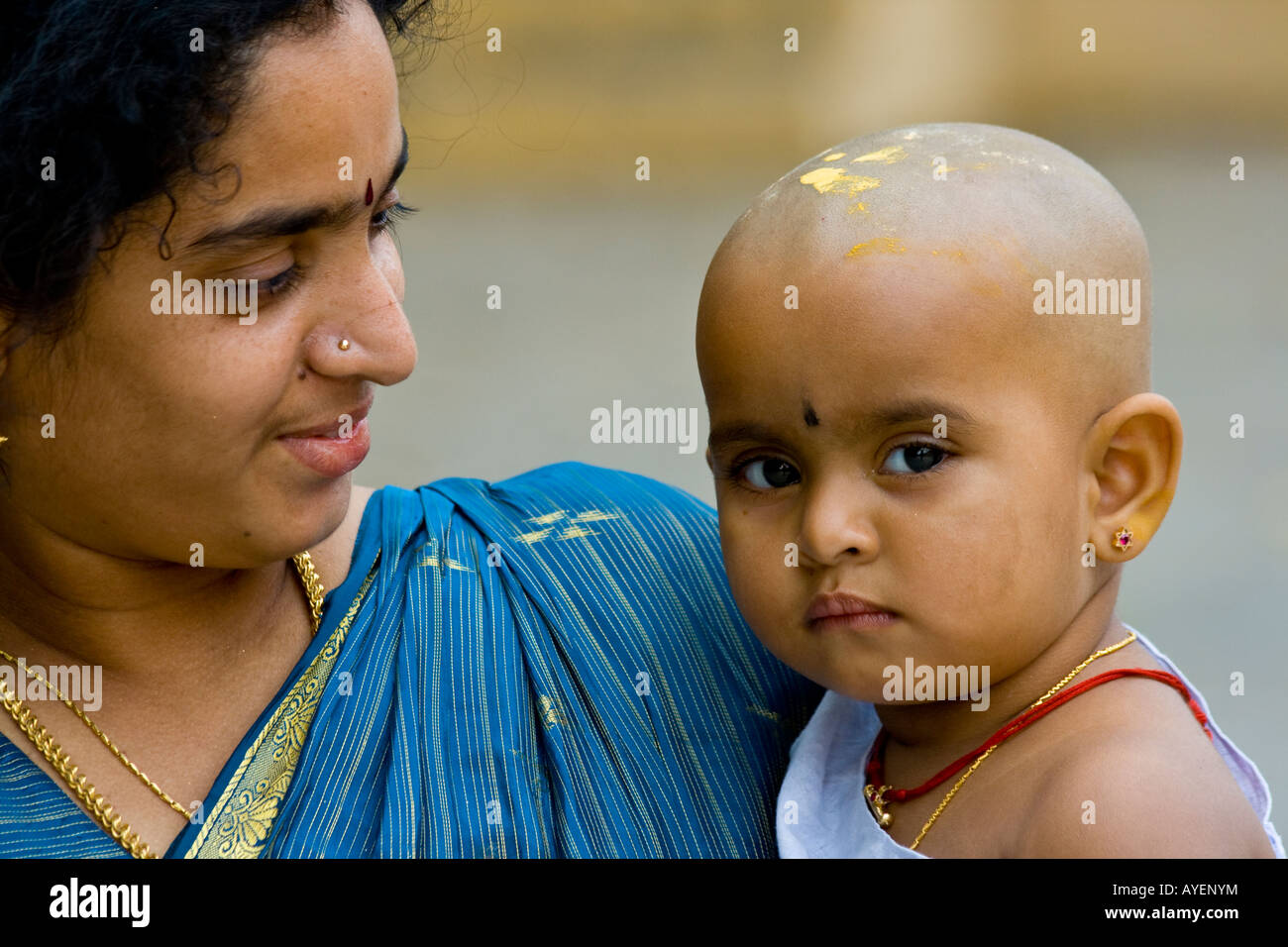 Indian Mother and Baby at Sree Meenakshi Hindu Temple in Madurai South India Stock Photo