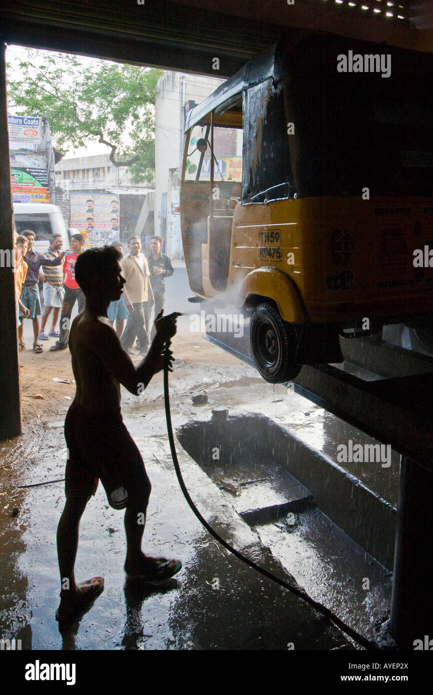 Young Indian Man in a Repair Shop Washing an Auto Rickshaw in Madurai ...