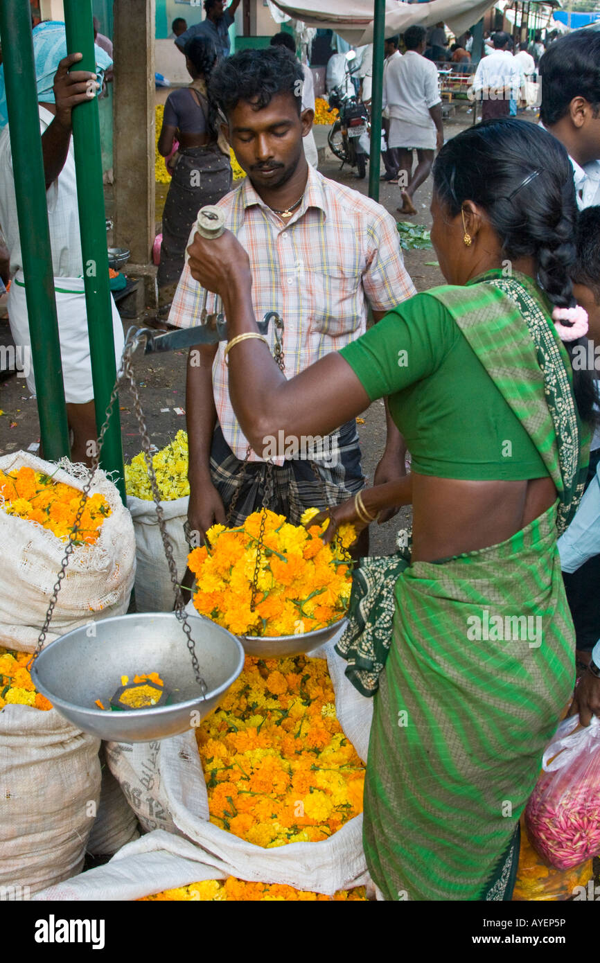 Measuring Flowers on a Scale in the Flower Market in Madurai South India Stock Photo
