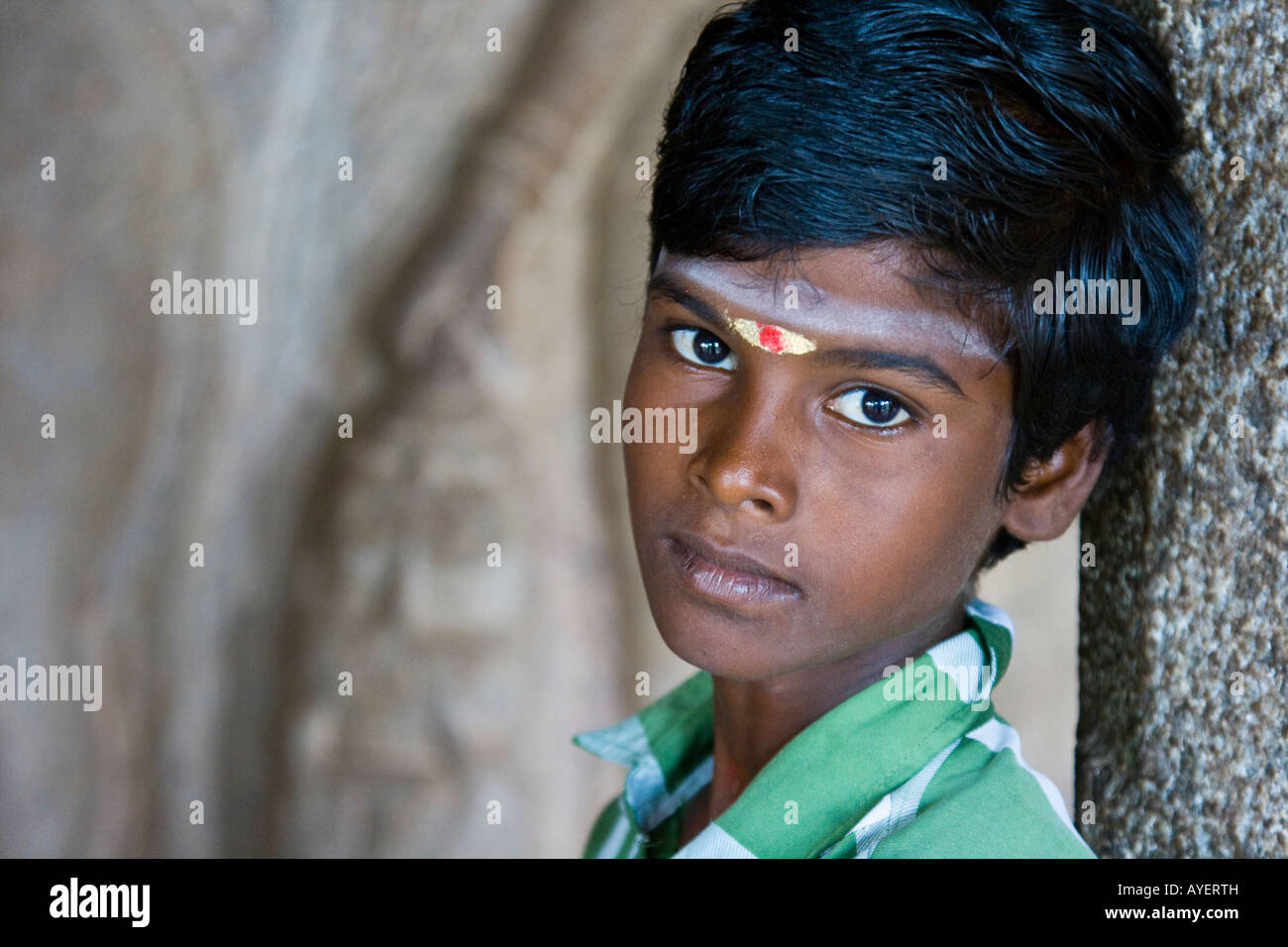 Hindu Boy Sitting inside a Mandapam in Mamallapuram South India Stock Photo