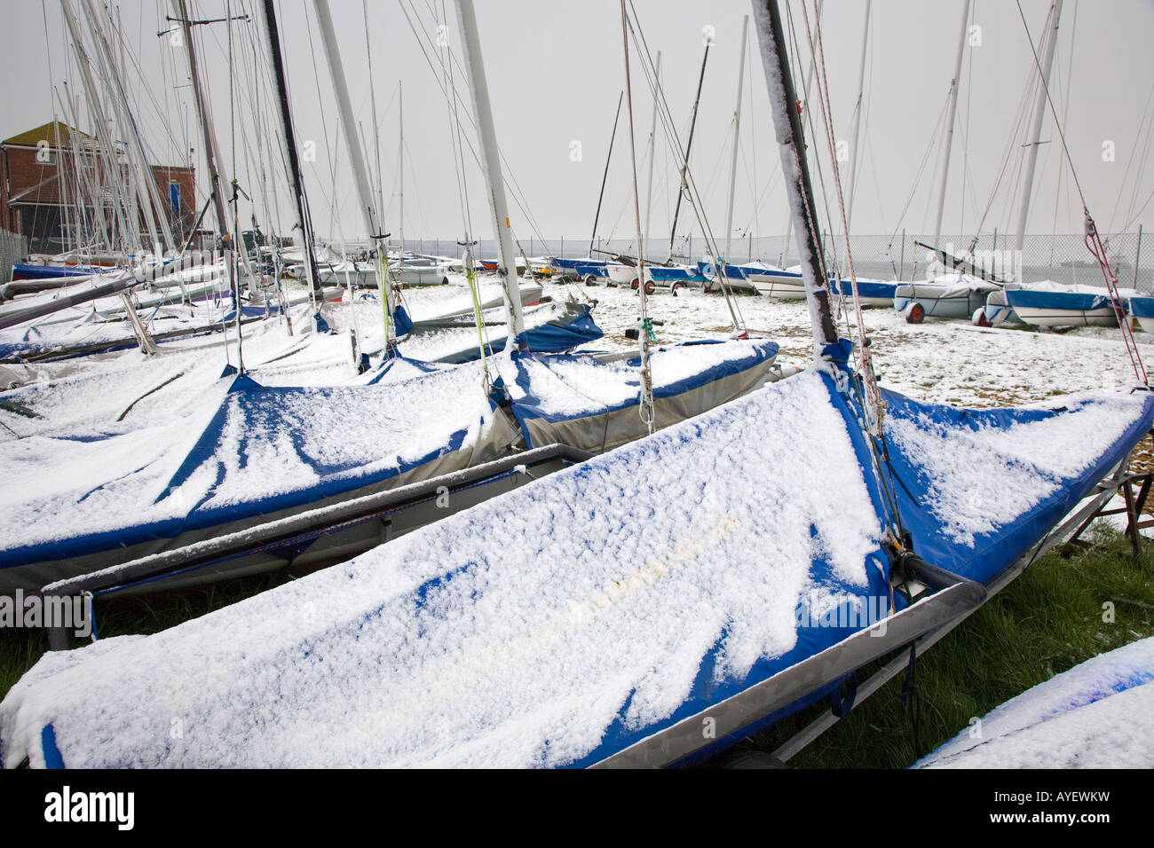 Snow covered sailing dinghy at Calshot Sailing Club in Winter Stock Photo Alamy