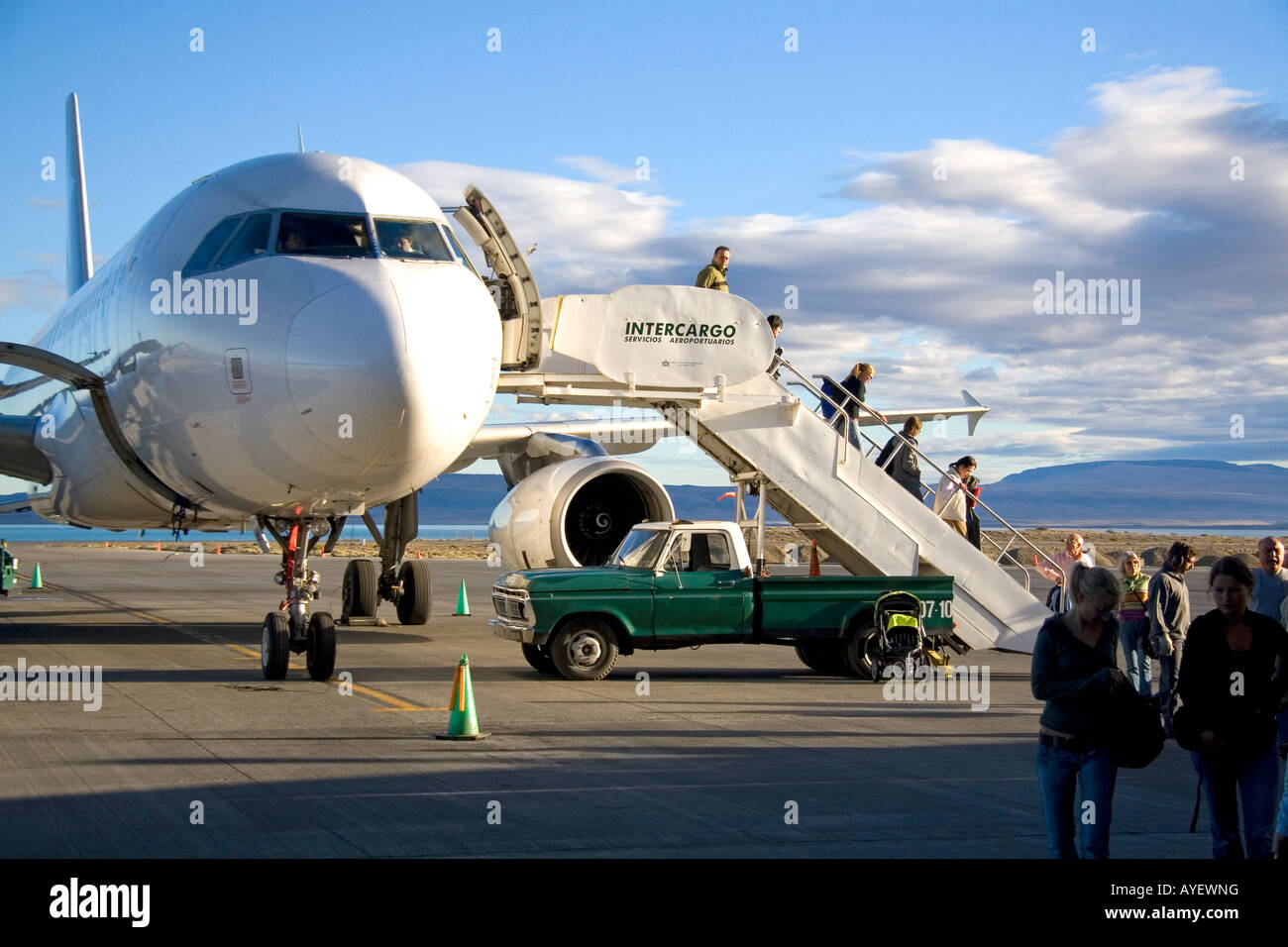 Passengers disembark an airplane at the El Calafate International Airport in Patagonia Argentina Stock Photo