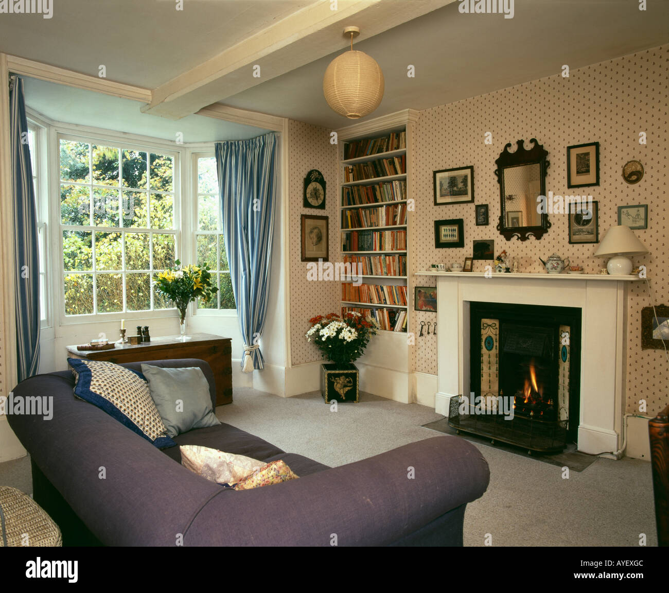 Country Livingroom With Fireplace And Ornaments Suspended From