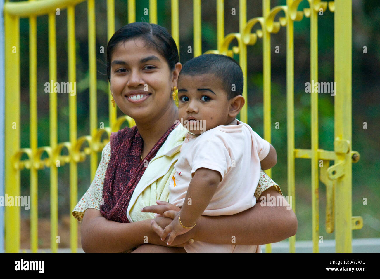 Woman holding baby india hi-res stock photography and images - Alamy