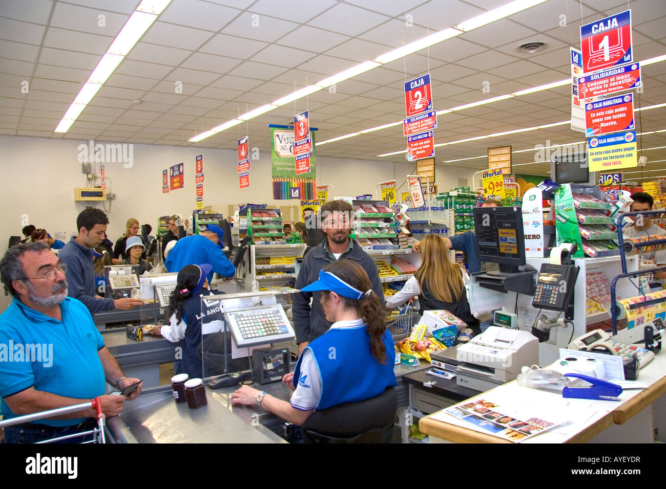 Customers in the check out line of a super market in El Calafate