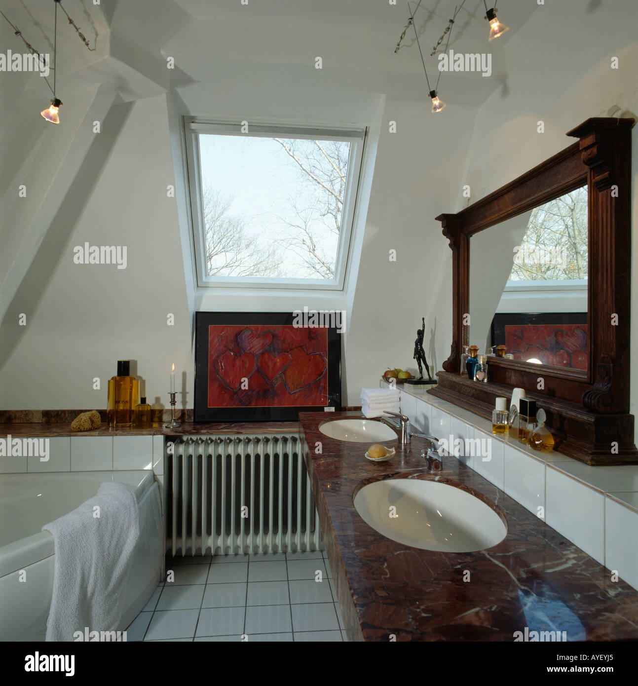 Attic bathroom with large mirror Stock Photo Alamy