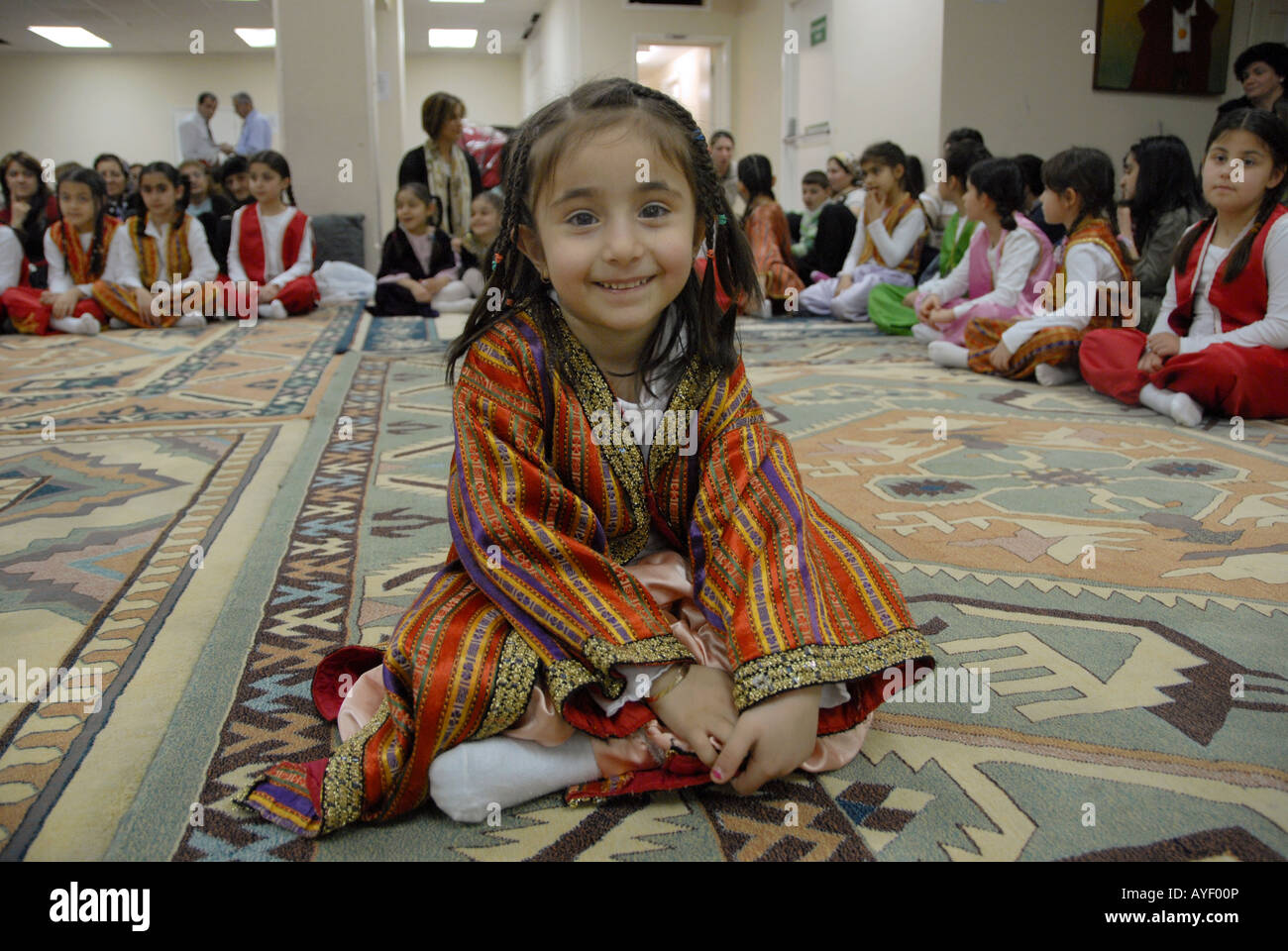 INFANT ALEVI GIRL IN TRADITIONAL DRESS Stock Photo