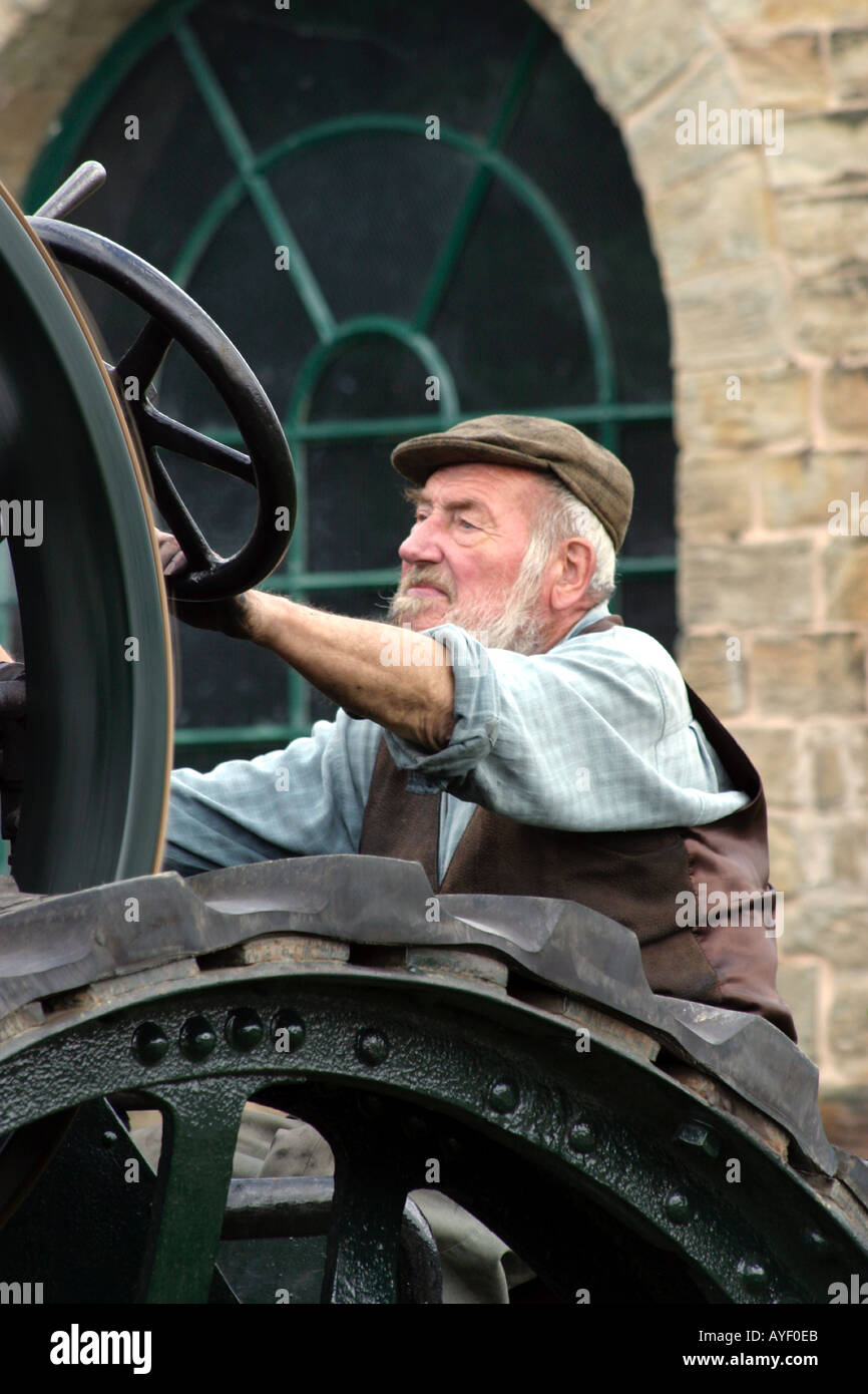 Man Riding Engine Elderly man running a traction engine Stock Photo - Alamy