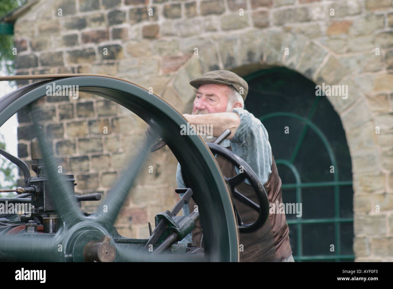 Elderly man running a traction engine Stock Photo