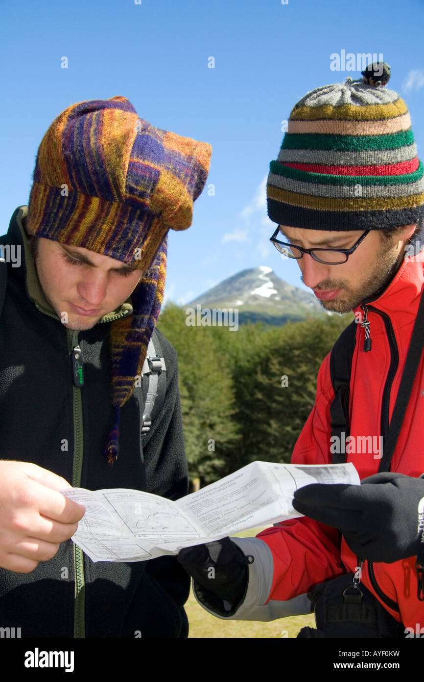 Hikers from Israel look at a map in the Tierra del Fuego National Park Argentina Stock Photo