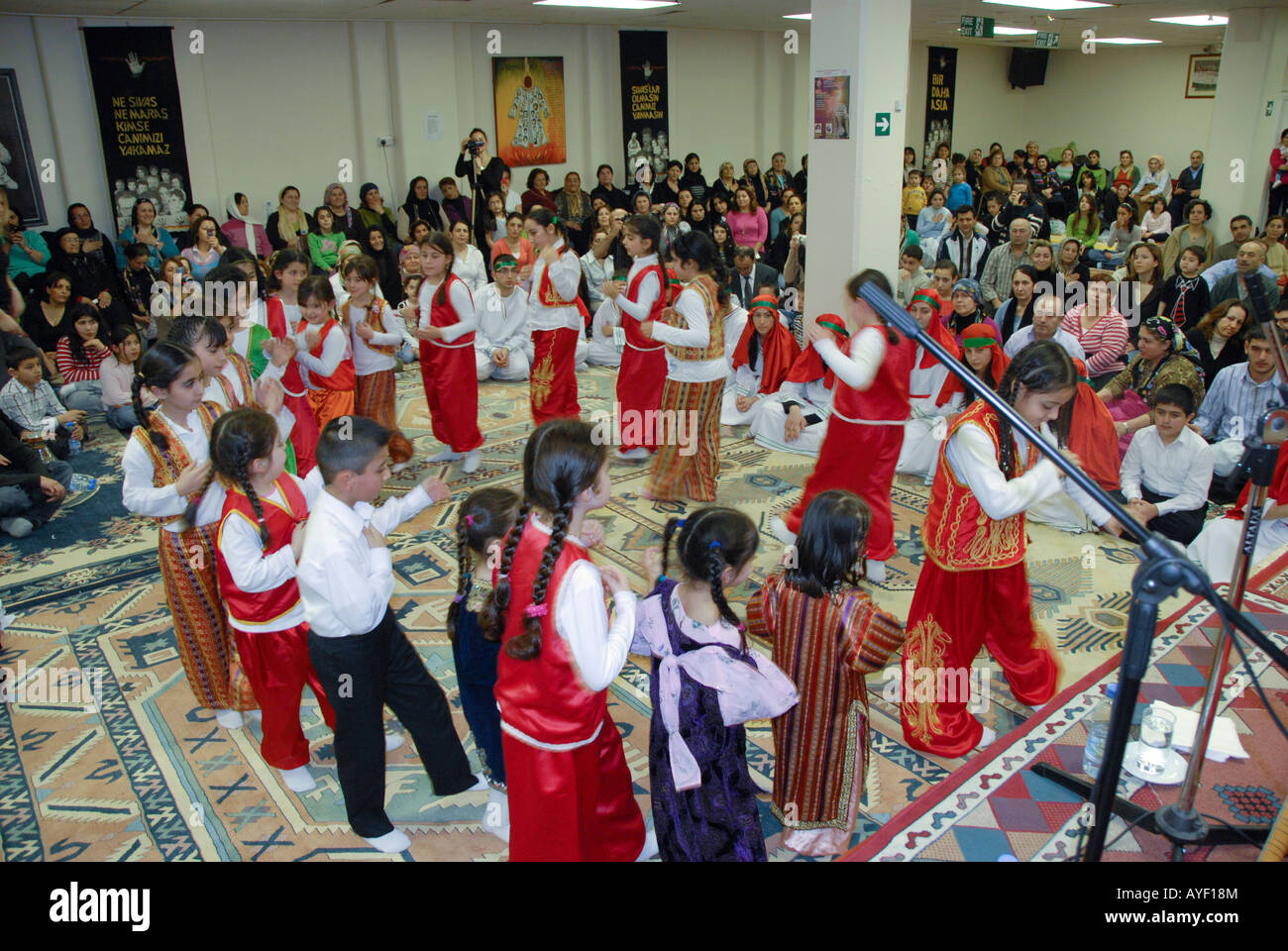 ETHNIC ALEVIS CHILDREN IN ALEVIS  CULTURAL CENTER DURING SEMAH CEREMONY IN NORTH LONDON Stock Photo