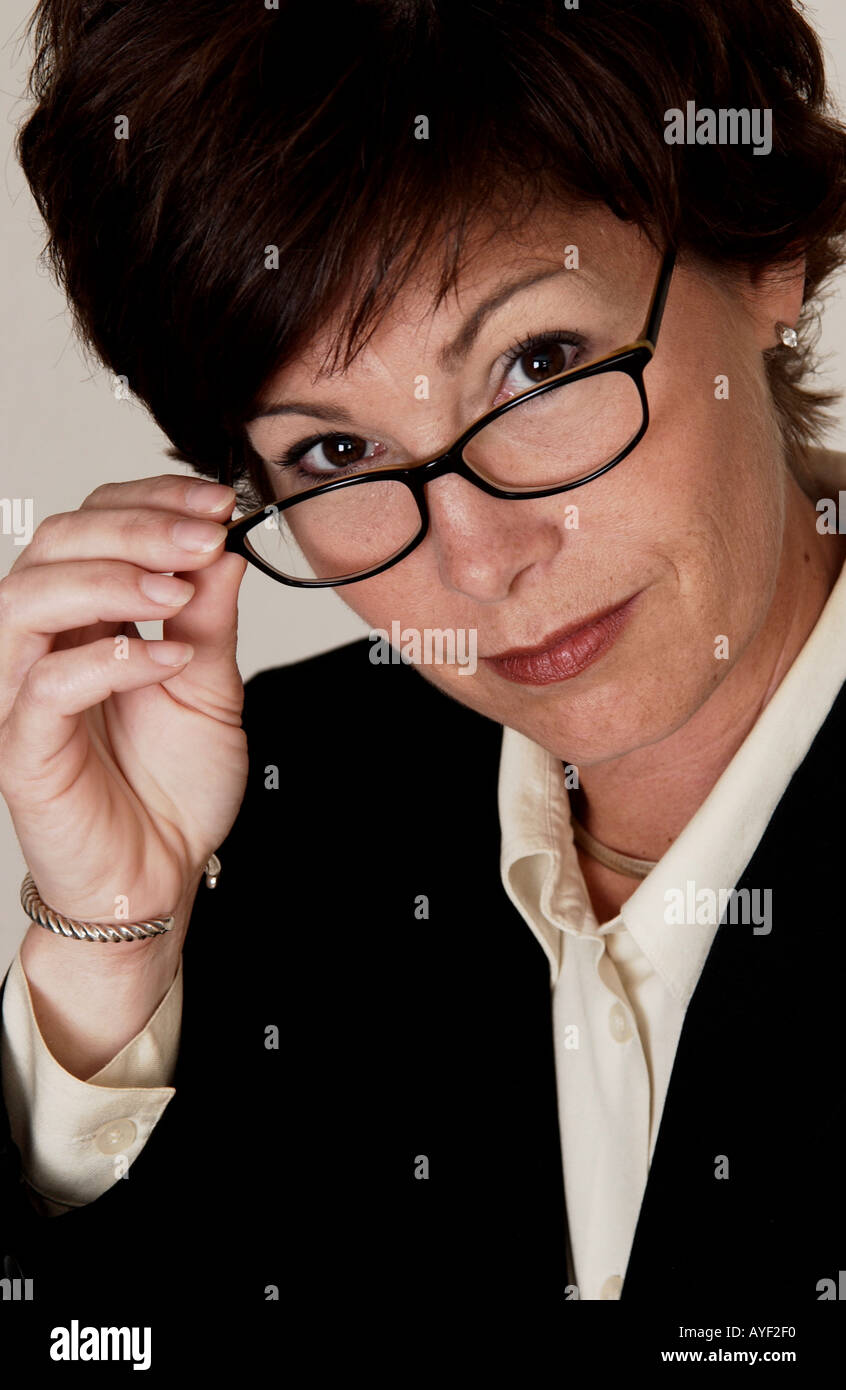 Woman holding her glasses Stock Photo - Alamy