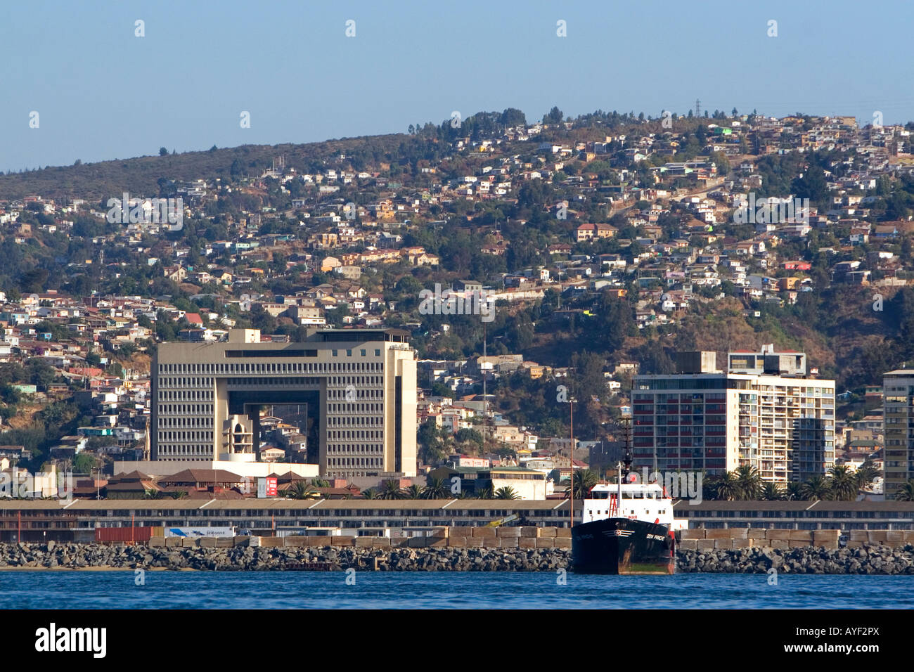 National Congress building and cargo ship in the Port at Valparaiso Chile Stock Photo