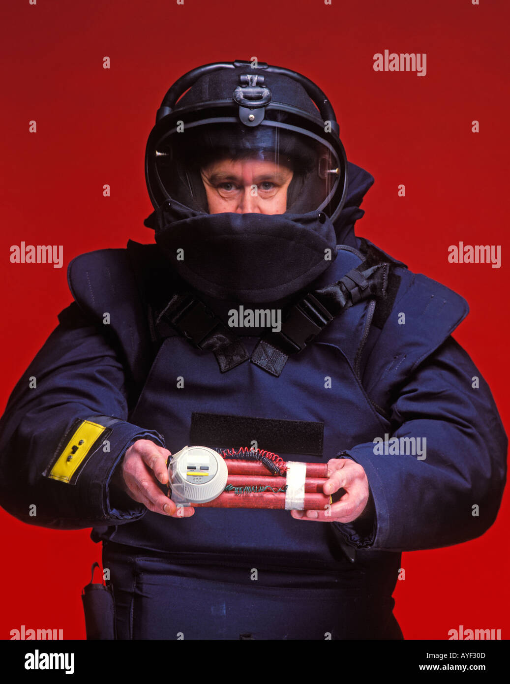 police technician carrying time bomb Stock Photo