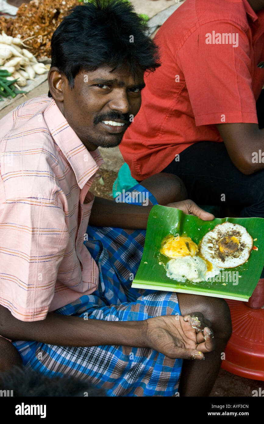 Man Eating Idlies in Madurai South India Stock Photo