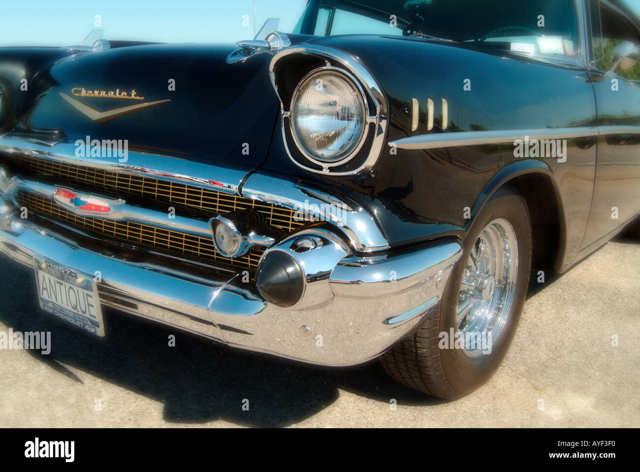 A black 57 Chevy Belair Original license plate number changed to ANTIQUE by the photographer Stock Photo