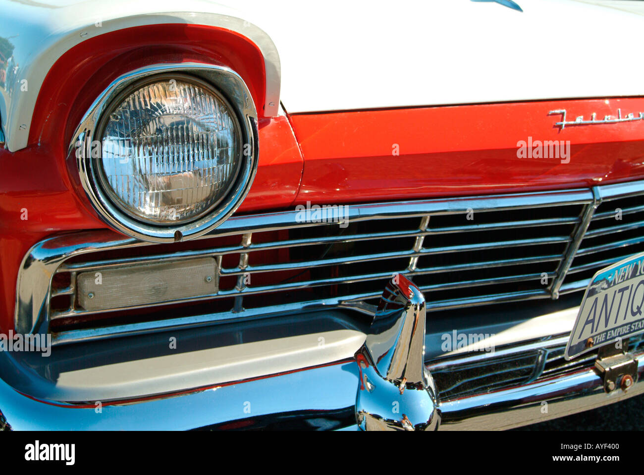 A red and white 57 Ford Fairlane Original license plate number changed to ANTIQUE by the photographer Stock Photo