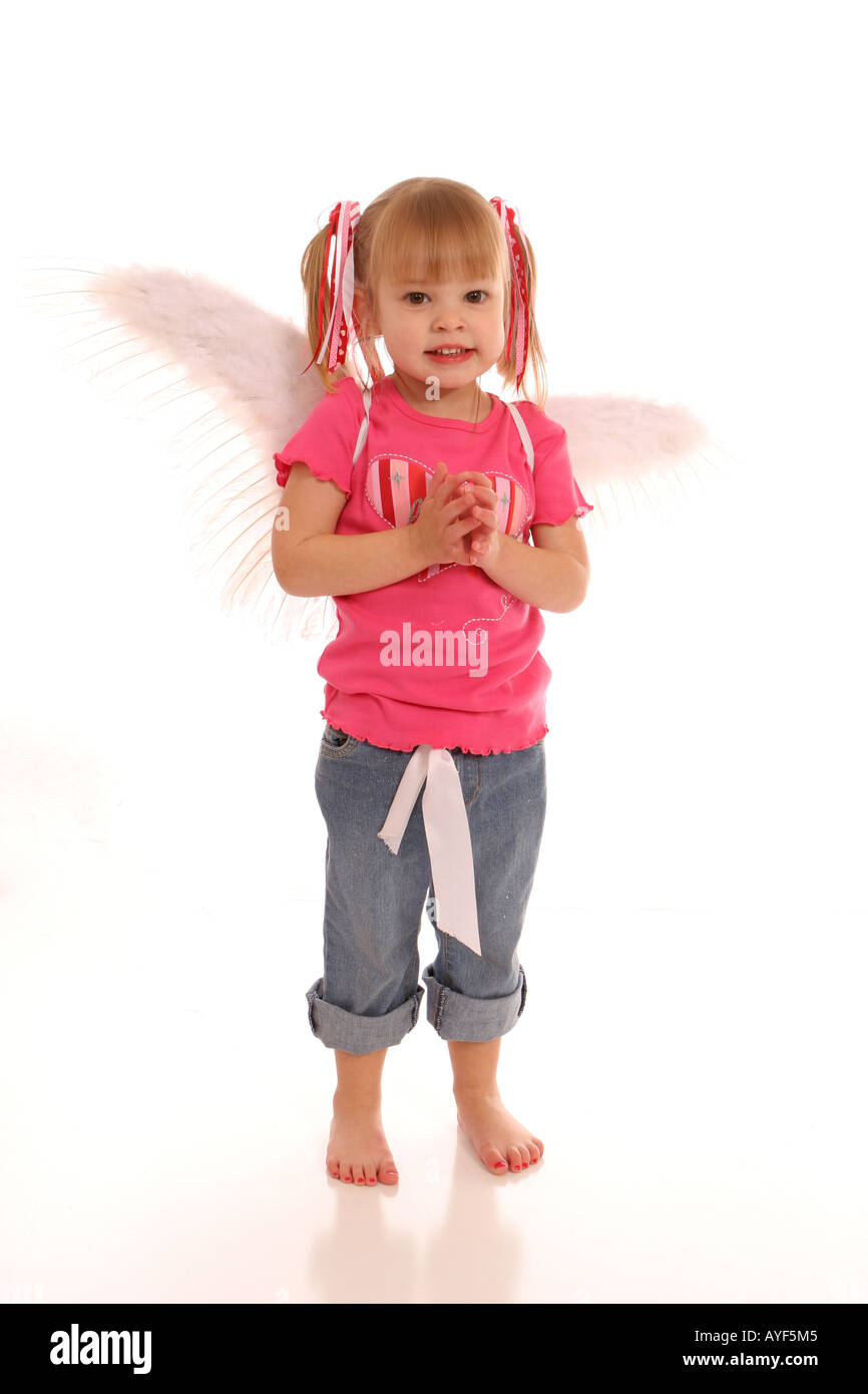 Little angel girl standing Stock Photo - Alamy