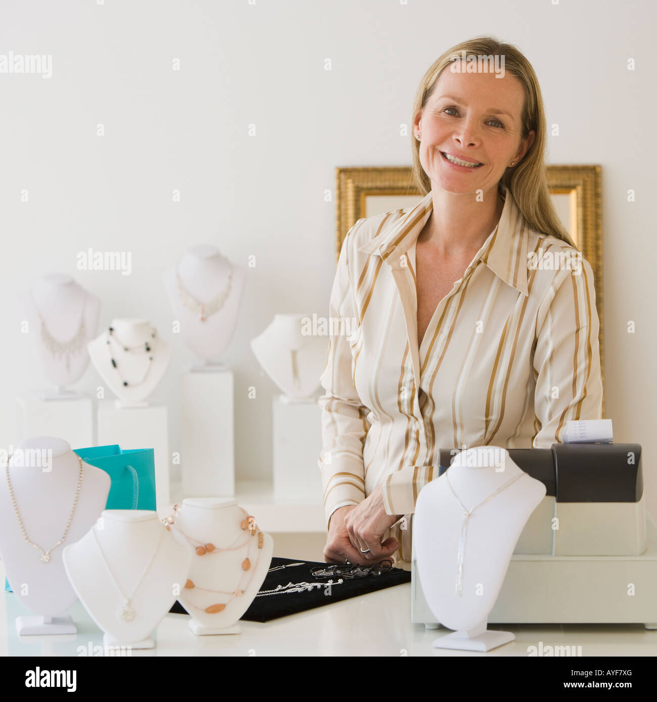 Woman, counter at jewelry store Stock Photo