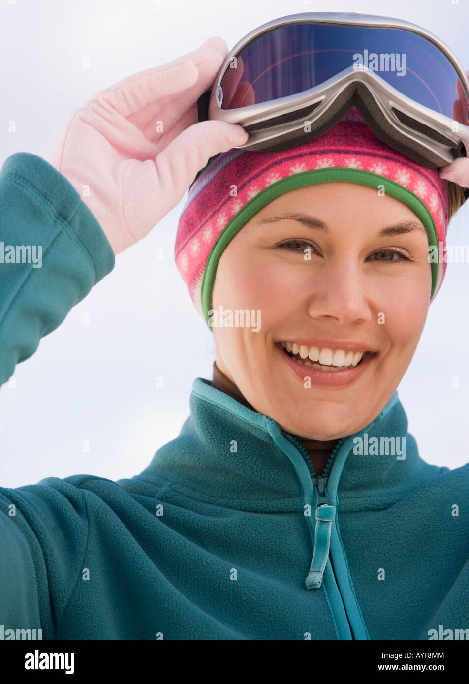 Woman wearing ski goggles Stock Photo Alamy