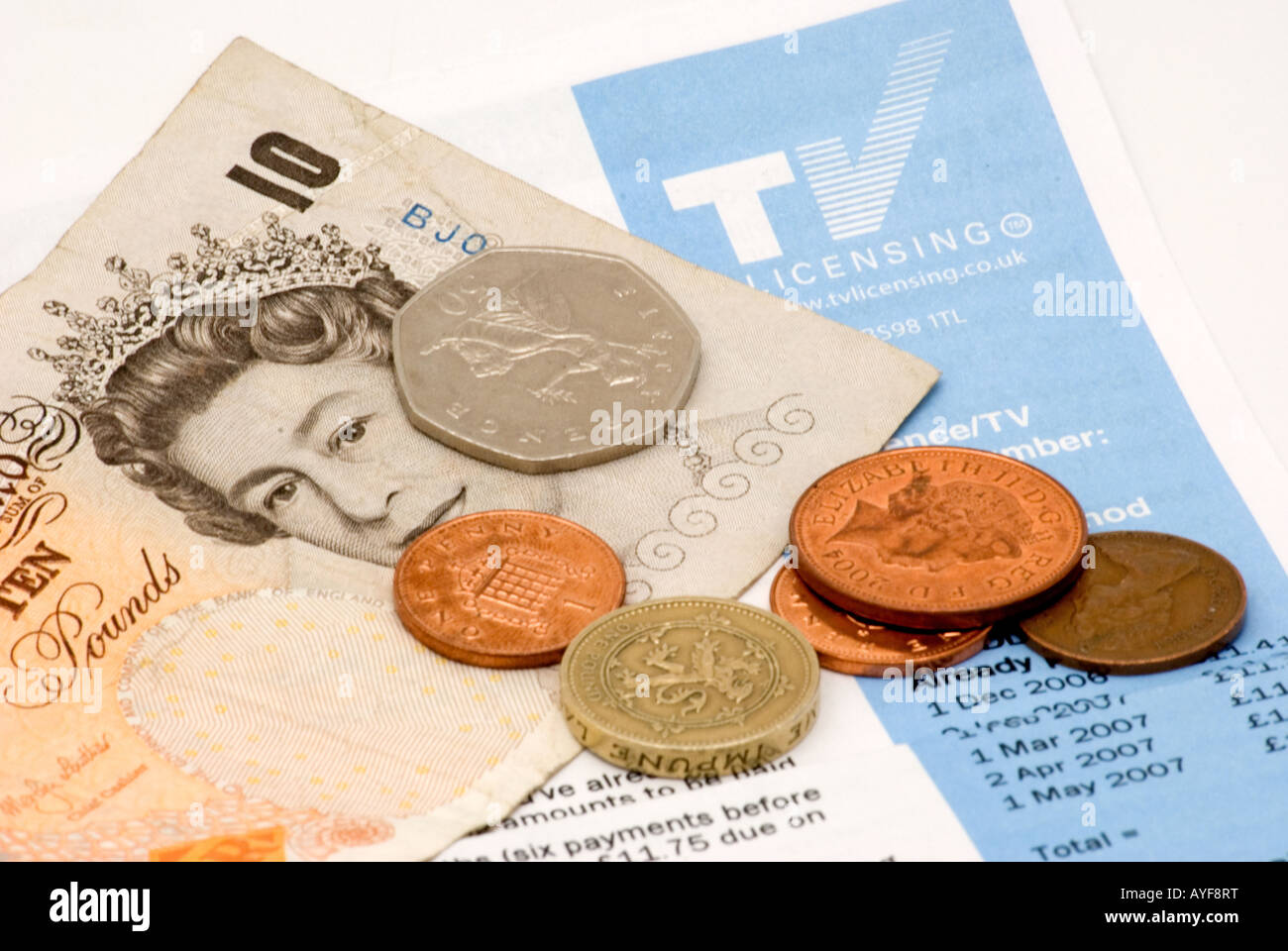 UK TV licence with money Stock Photo