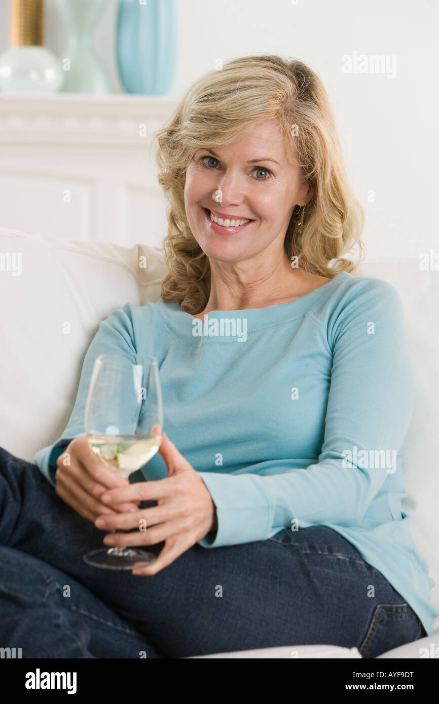 Woman holding glass of wine Stock Photo - Alamy