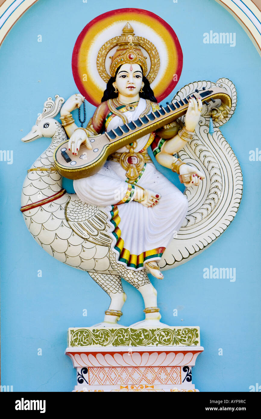 Hindu goddess Saraswati statue located on the front of a university building in the Southern Indian town of Puttaparthi Stock Photo