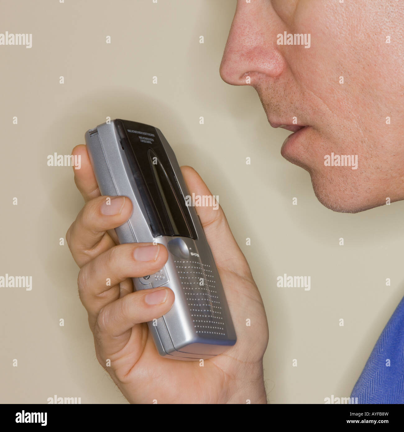 Man talking into voice recorder Stock Photo Alamy