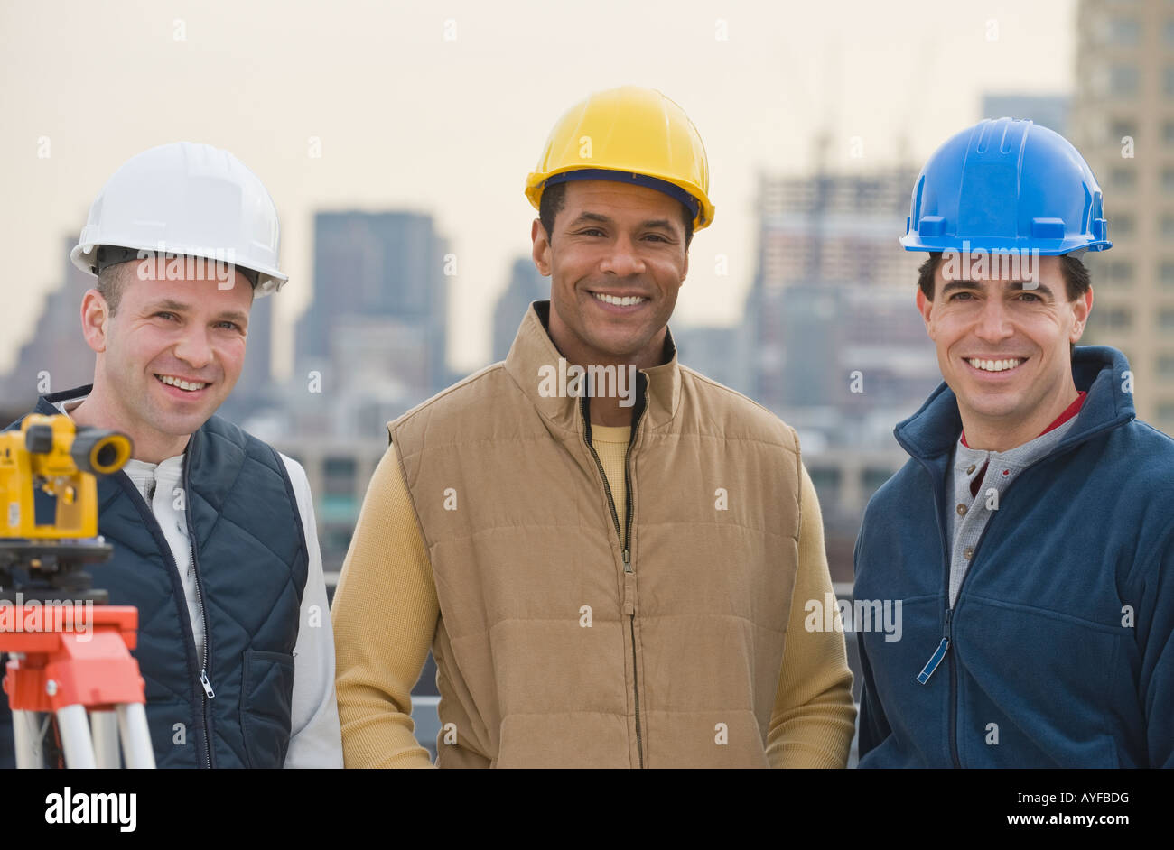 Multiethnic male construction workers wearing hard hats Stock Photo Alamy